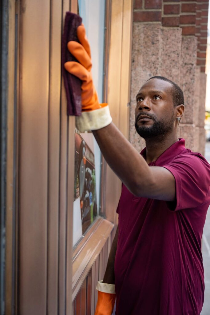 Man in Signature shirt working on metal restoration